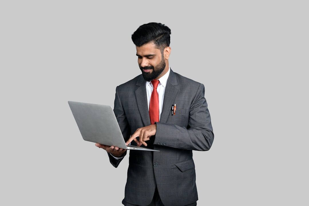 Finance director presenting growth charts on a laptop