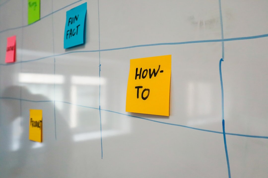Team brainstorming innovation ideas with sticky notes on a glass wall